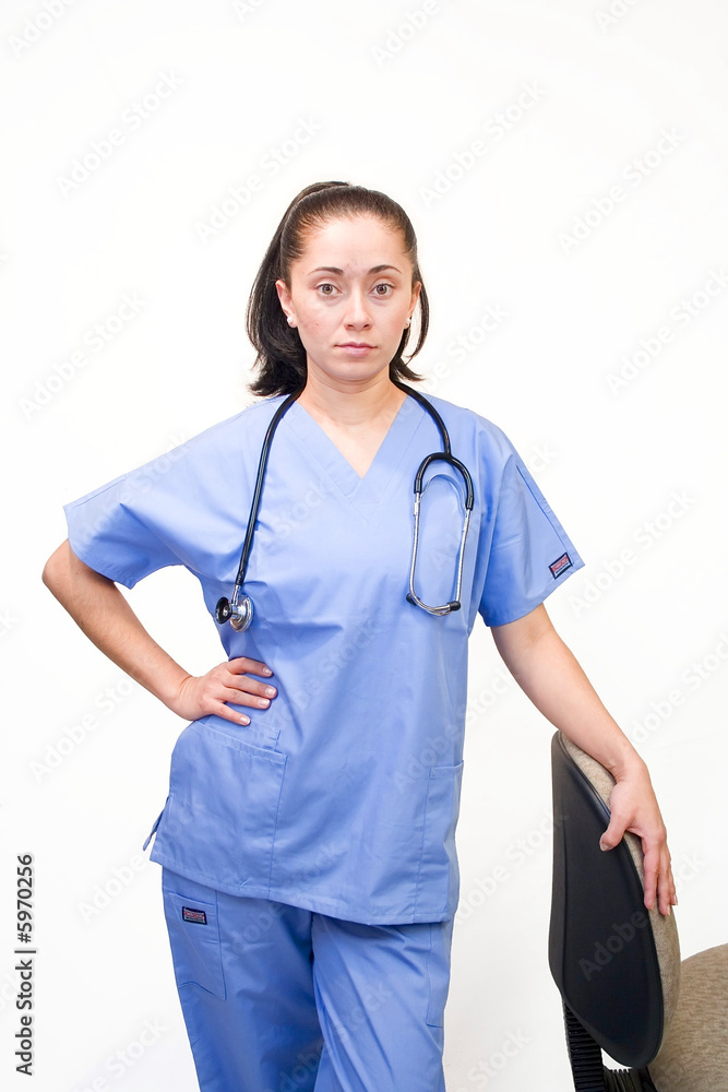 Pretty Hispanic nurse isolated on white Pretty Hispanic nurse isolated on white