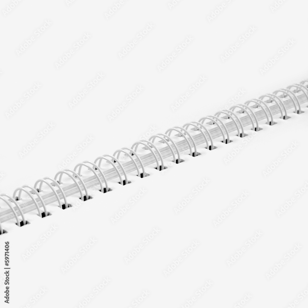 Open, blank notebook with spiral binding in the middle. Open, blank notebook with spiral binding in the middle.