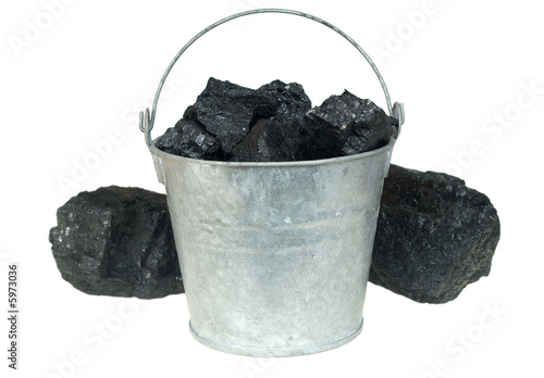 Pieces of coal  in bucket isolated on white background