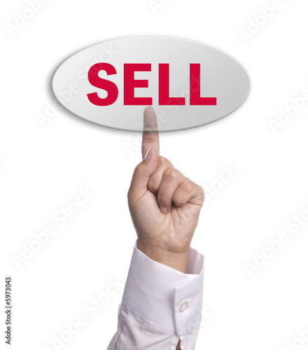 woman hand presses the sell key, isolated