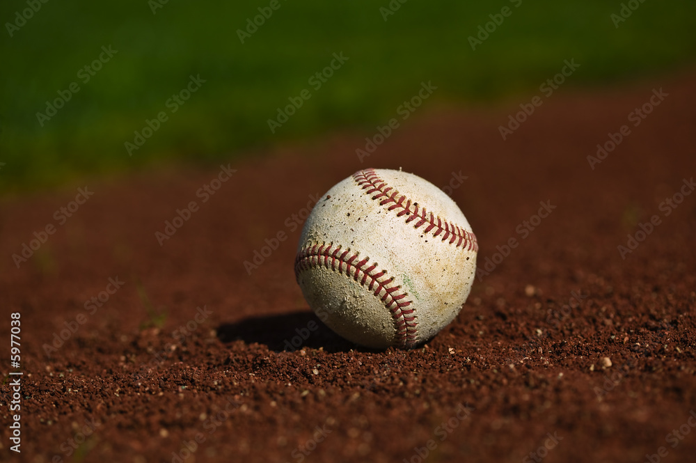 Baseball on the green grass of a ball field