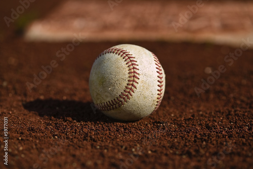 Baseball on the green grass of a ball field