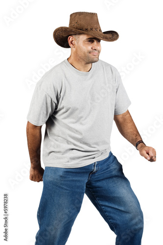 Young man with cowboy hat on the move