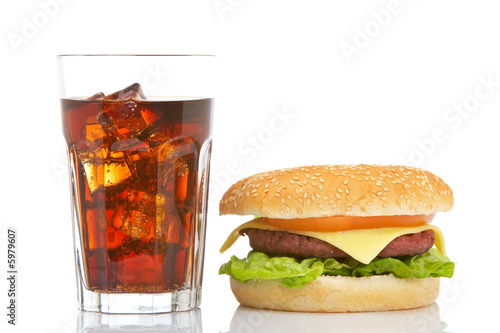 Burger and soda, reflected on white background. Shallow DOF