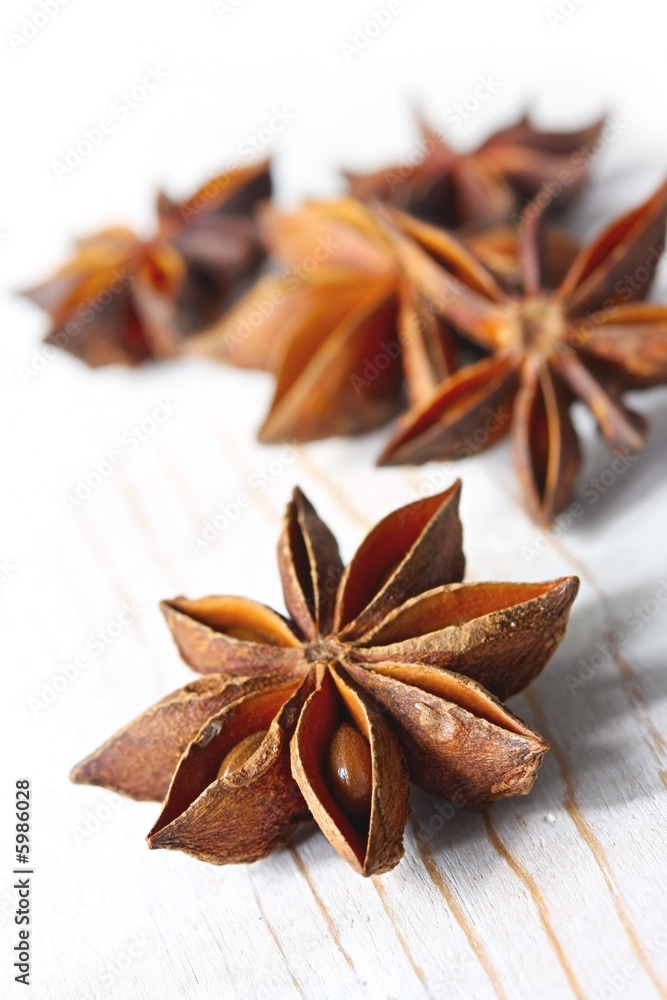 Star anise on weathered white timber.  