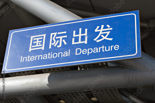 stained sign: "international departure"