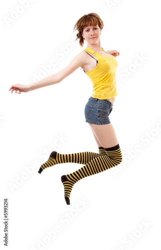 Young chierful jumping girl  isolated at the white background photo