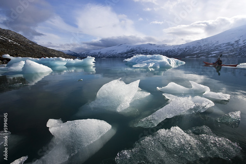lonely kayak in glacier frost lake