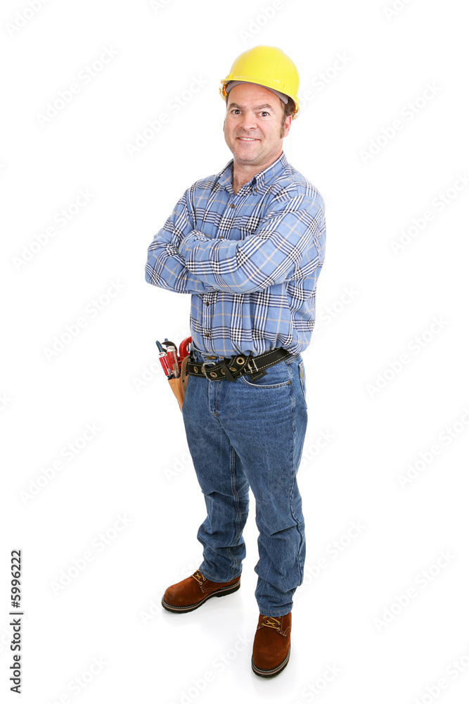 Authentic construction worker smiling with arms crossed. Authentic construction worker smiling with arms crossed.