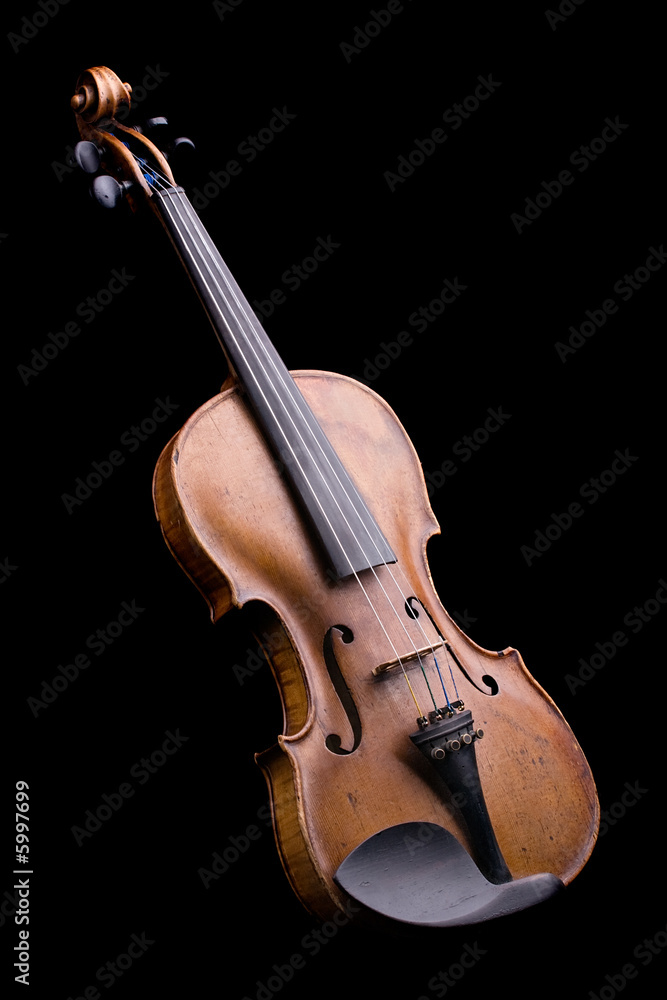 old violin close-up isolated on black background