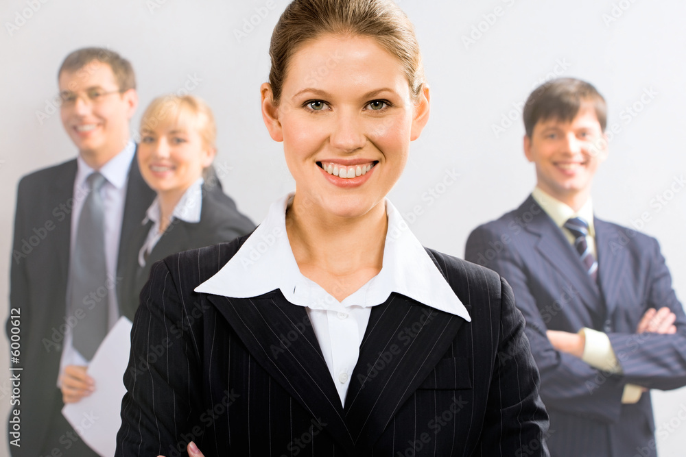 Portrait of attractive leader with her business team 