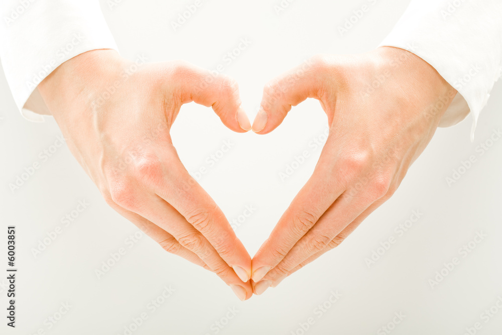 Image of woman’s hands made in the form of heart Image of woman’s hands made in the form of heart