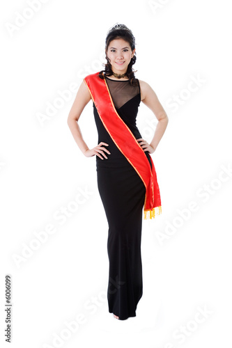 woman friendly smile of a pageant queen wearing red sash