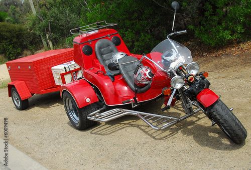 red tricycle with towing box 