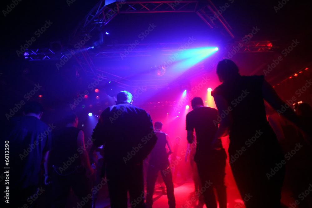 Dancing people in an underground club