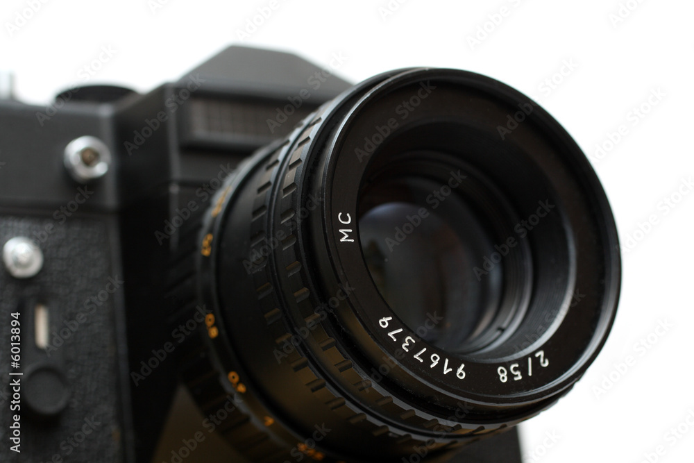 black slr camera with lens close-up isolated on white