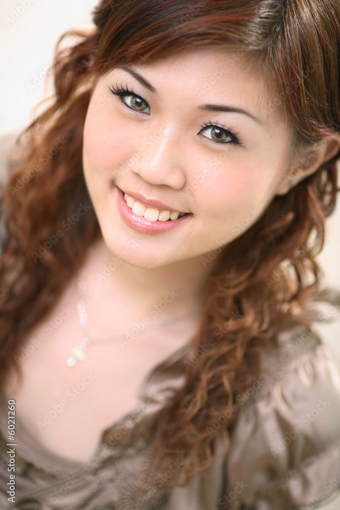sweet smiling woman with long brown curly hair sweet smiling woman with long brown curly hair