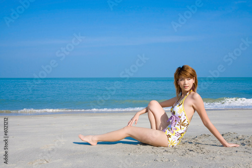 woman relaxing by the beach 