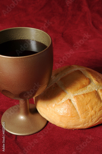 Communion elements close up over a red background photo