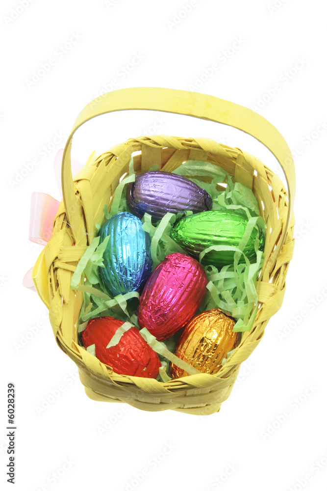 Easter Eggs in Bamboo Basket on White Background