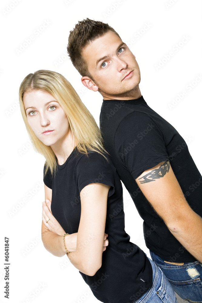 couple standing back to back 