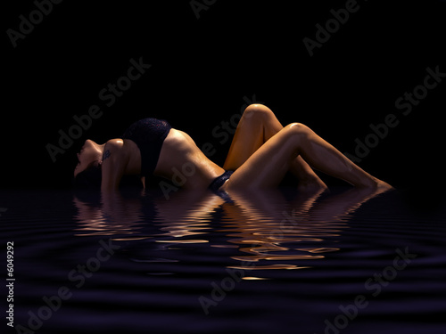 seductive brunette in underclothes isolated on black background