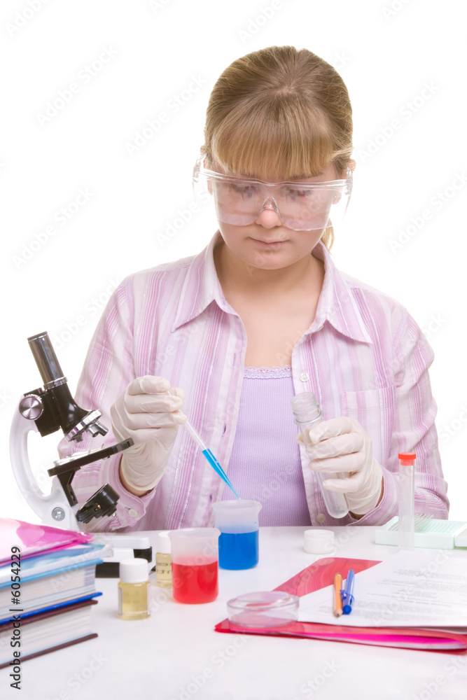 Student performing experiments with different liquids Student performing experiments with different liquids