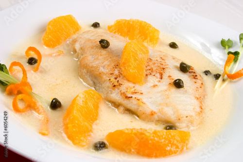 Photos Closeup of grilled skate (ray) with orange and caper sauce