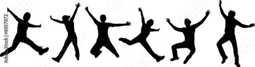 Silhouettes of jumping people photo