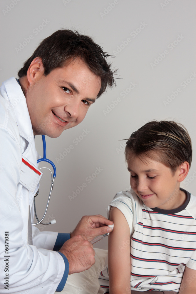 A child receives an immunisation or vaccination shot. A child receives an immunisation or vaccination shot.