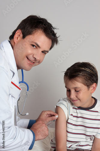 A child receives an immunisation or vaccination shot.