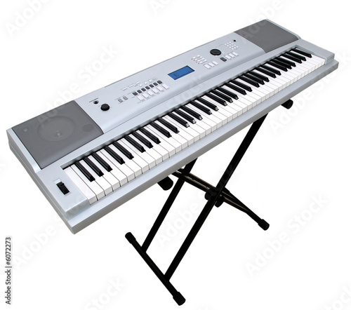 Digital portable piano on stand isolated on white background