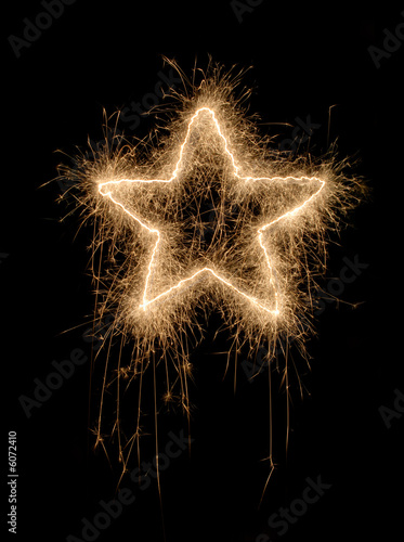 SParkling star made of fireworks on black background