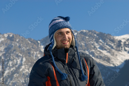 Smiling man in winter mountain