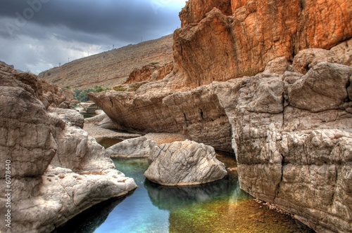 Canyon / Oasis in the desert of the sultanate Oman near Muscat photo