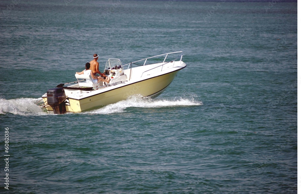 Naklejka premium Yellow Outboard Motor Boat