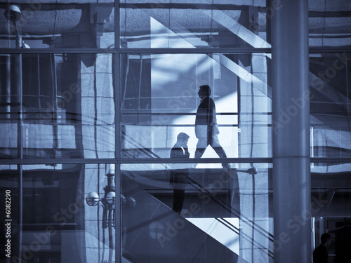 Business men in the city, back to work, office environment, social distancing. 