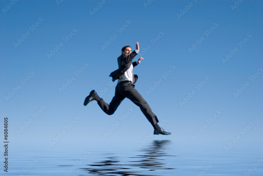 Businessman jumping in the air