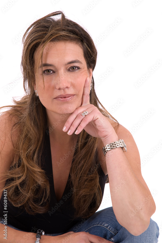 Beautiful brunette leaning on her hand on white Beautiful brunette leaning on her hand on white