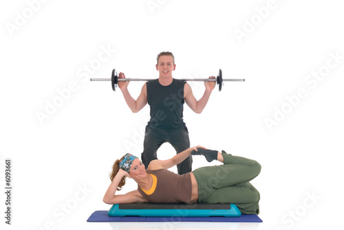 Young couple, female, male doing fitness exercises 