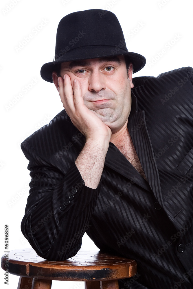 The man in a black suit on a white background The man in a black suit on a white background