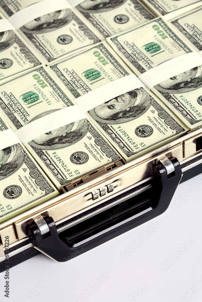Close-up of briefcase with plenty of US dollars in it Close-up of briefcase with plenty of US dollars in it