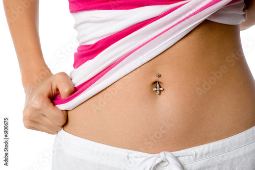 A woman shows off her belly button piercing photo