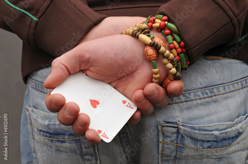 Ace of hearts in hand - hide trump photo