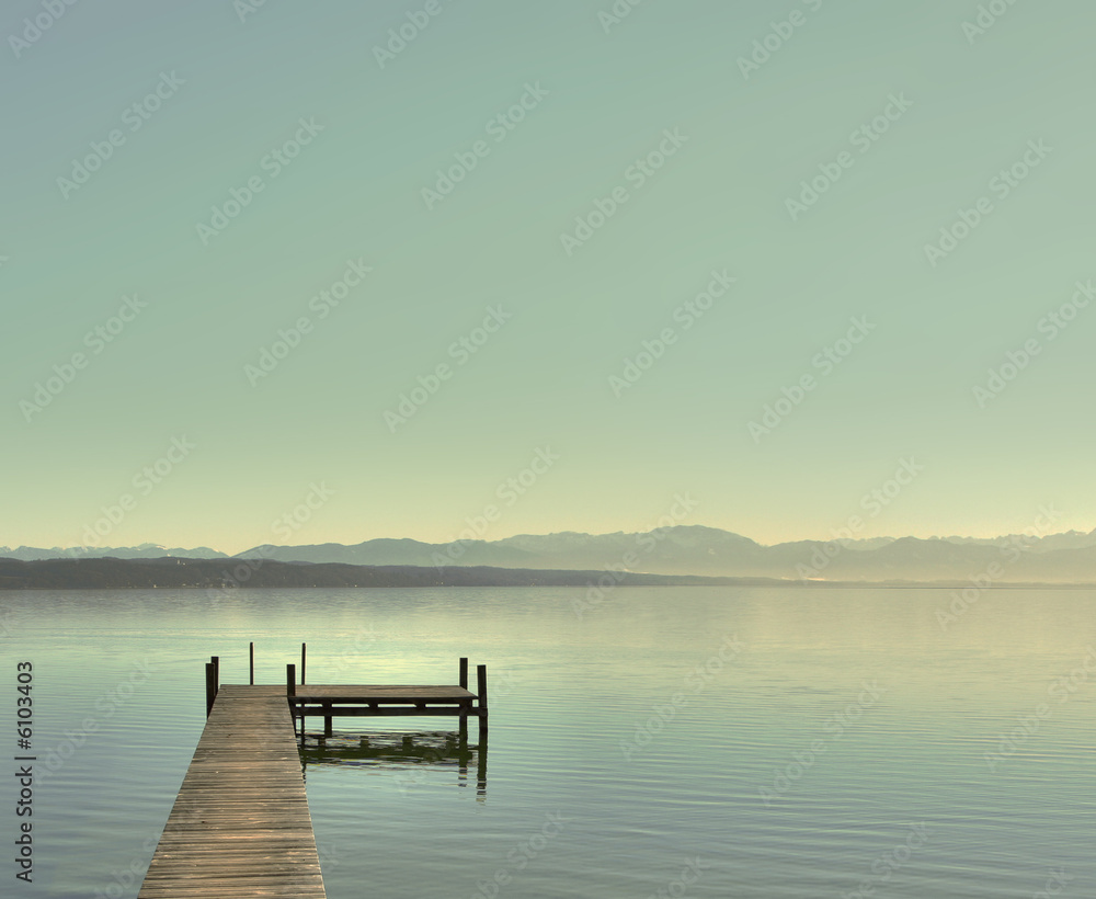 A Photograph of a blue lake at a bright day.