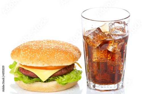 Hamburger and soda, reflected on white background. Shallow DOF