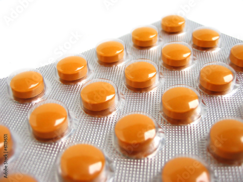 Close-up of a pack of orange pills