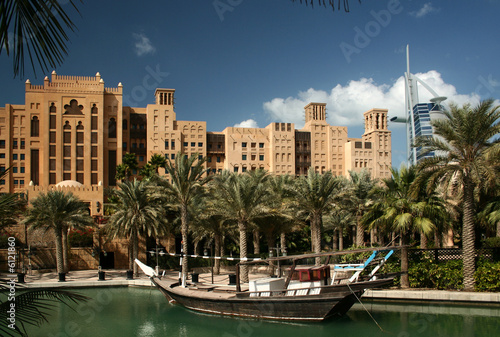 Dubai, Madinat Jumeirah park with the lake and the boat