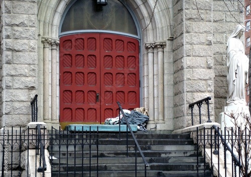 sleeping by the church door