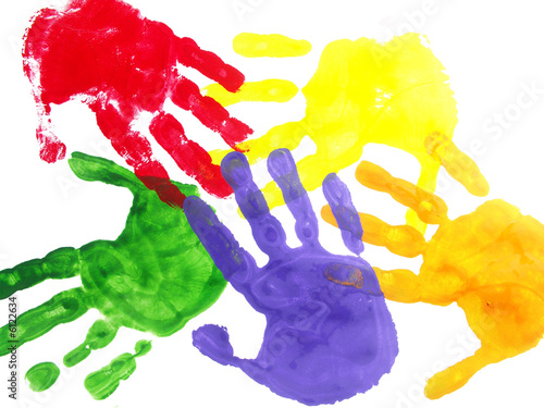 Color hand prints painted on a white paper